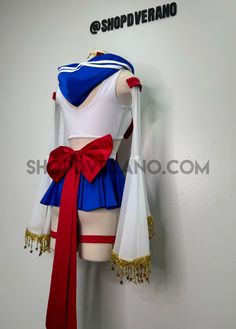 a woman's cosplay is hanging on the wall with her red, white and blue outfit