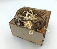 The Bear head custom bracelet is made of 550 paracord and hand crafted shackle and bear clasp of Italian bronze. It`s made to order so you can chose the color and size of the cord bracelet. The Bear bracelet is made with inspiration on Viking and Slavic mythology and jewelry. It`s can be a perfect men's gift for who likes paracord bracelets, EDC and survival. The rope bracelet transports in a wooden gift box. Other paracord bracelets by the link: https://www.etsy.com/shop/WikkedKnot?ref=seller-p Durable Paracord Braided Bracelet For Outdoor, Durable Paracord Bracelets For Outdoor, Bear Bracelet, Slavic Mythology, Custom Bracelet, Bear Head, Wooden Gift Boxes, Paracord Bracelet, 550 Paracord