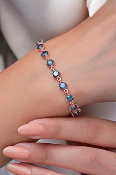 This exquisite London Blue Topaz bracelet is not just a piece of jewelry but a story waiting to be told. Known as the stone of clarity and communication, London Blue Topaz is believed to inspire creativity and enhance self-expression. Set in high-quality 925 sterling silver, this adjustable tennis bracelet is a perfect blend of elegance and meaning, making it an ideal Christmas gift for someone special. ✨ London Blue Topaz: Renowned for its deep, captivating blue hue, this gemstone symbolizes ca Luxury Blue Topaz Bracelet, Tennis Jewelry, Special Christmas Gift, Blue Topaz Bracelet, November Birthstone, Custom Name Necklace, Wedding Jewelry Bracelets, London Blue, London Blue Topaz