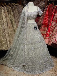 Iced cube sliver lehenga with frosted crystal embroidery teamed with a spaghetti strap blouse with crystal embroidery and net dupatta. Fabric: Net Custom designed according to client measurements and color preference. Production and delivery time is 120 days! Designer Embellished Silver Lehenga, Designer Silver Embellished Choli, Designer Embellished Silver Choli, Party Silver Sharara With Intricate Embroidery, Party-ready Silver Sharara With Intricate Embroidery, Festive Silver Hand Embellished Dupatta, Festive Hand Embellished Silver Dupatta, Festive Silver Hand-embellished Dupatta, Silver Anarkali Style Hand Embellished Sharara