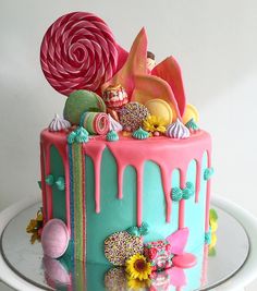 the cake is decorated with candy and candies