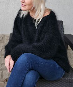 "Hand knit mohair sweater for cozy evenings. It is wonderful for cold season. It is loose knitted and fluffy The material of this sweater is mix of 50% mohair and 50% polyester. Color - black. The mohair has a beautiful long fiber which gives the sweater a soft and luxurious look. The sleeves of this sweater have a loose wide fit, the sleeves are long. On a photo sweater in black (15) color Length 23\" for XS-S, 24\" for M - L,24\" for XL The same sweater in white https://www.etsy.com/listing/74 Black Alpaca Sweater For Fall, Cozy Black Mohair Sweater, Fall Black Alpaca Sweater, Black Mohair Winter Sweater, Black Mohair Sweater For Winter, Cozy Black Chunky Knit Sweater, Black Mohair Sweater For Fall, Hand Knitted Black Sweater For Winter, Black Mohair Long Sleeve Sweater