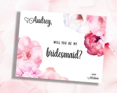 a card that says, will you be my bridesmaid? with pink flowers