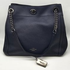 Brand: Coach Style: Turnlock Edie Shoulder Bag / 36855 Condition: Very Good Pre-Owned Condition Exterior Color: Navy Interior Features: Center Zip Compartment With Inside Zip And Multifunction Pockets Closure: Turnlock Straps: Two Chain Shoulder Straps Approx. Measurements: 12.75" L X 11" H X 5.75" W Includes: Coach Hangtag No Lowball Offers Or Trades Please. I Do Not Discuss Prices On Listings. Thank You For Looking! Elegant Blue Satchel With Silver-tone Hardware, Formal Blue Coach Satchel, Classic Blue Bags With Silver-tone Hardware, Navy Interior, Navy Blue Color, Coach Bags, Shoulder Straps, Bag Lady, Navy Blue