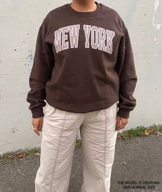 This brown crewneck New York sweatshirt is a trendy addition to your closet! This sweatshirt is so cozy and oversized that you won't want to take off! Cute, comfortable and trendy -- a necessity for any aesthetic clothing collection! The material is the classic gildan medium weight hoodie material that we all know and love.  * Graphic is a high quality digital print which is durable and long lasting! * 50% cotton / 50% medium weight poly fabric blend * Wash and dry normally (on cool for best res Oversized Y2k Sweatshirt For Fall, Trendy Campus Sweatshirt For Fall, Trendy Fall Sweatshirt For Campus, Trendy Sweatshirt For Campus In Fall, Oversized Y2k Sweatshirt With Letter Print, Y2k Oversized Letter Print Sweatshirt, Y2k Fall Sweatshirt, Y2k Graphic Print Sweatshirt For Fall, Y2k Crew Neck Sweater With Graphic Print