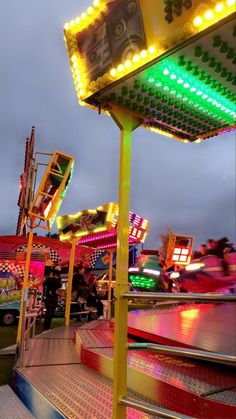 the carnival rides are brightly lit up at night