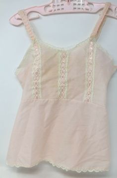 Vintage Girls Toddlers Pink Cotton Dress Slip Petticoat With Lace & Ribbon Trim In good vintage condition, with light stain on back Please view pics as they are part of the description Measures approx 15 1/2" long, by 11" arm pit to arm pit, 9 1/2" across waist  Please check out my feedback and bid with confidence. I will be listing other vintage items, and I happily combine shipping in the US! Daywear Camisole Dress With Lace Trim, Camisole Dress With Lace Trim For Daywear, Fitted Vintage Camisole For Spring, Lace Trim Camisole Dress For Sleepover, Retro Summer Costume Dress, Pink Lace Camisole Dress, Fitted Petticoat For Dress-up Occasions In Spring, Spaghetti Strap Dress With Lace Trim For Sleepovers, Sleeveless Coquette Bedtime Dress