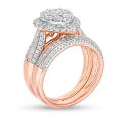 All your beautiful moments shine through this compelling pear-shaped multi-diamond bridal set in rose gold. Crafted in precious 10K rose gold The impressive engagement ring features a dazzling pear-shaped composite of diamonds - the largest a 1/5 ct. stone - wrapped in a diamond halo. The sculpted triple-row shank shimmers with diamonds along a tapered design. Completing her ensemble, the coordinating wedding band glistens with three rows of diamonds. This bridal set captivates with 1-1/2 cts. t.w. of diamonds. Rose Gold Diamond Bridal Sets In Fine Jewelry, Rose Gold Diamond Bridal Set, Diamond Frame, Bridal Engagement Rings, Diamond Bridal Sets, Stone Wrapping, Rose Gold Metal, Bridal Set, Diamond Halo