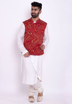 Readymade Art Silk Asymmetric Kurta in White. This Collar Neck and Full Sleeve attire is Prettified with Buttons, Zipper, Bandhej Print and has One Welt Pocket, One Inside Pocket and Two Side Pockets. Available with a White Cotton Churidar and a Red Faux Crepe Nehru Jacket. Do note: Footwear shown in the image is for presentation purposes only. Half to one inch may vary in measurement. (Slight variation in actual color vs. image is possible). We sell all kinds of menswear. Mens Kurta | Mens Kurt Red Wedding Kurta For Spring, Traditional Red Nehru Jacket With Long Sleeves, White Long Sleeve Festival Outerwear, Red Traditional Nehru Jacket For Winter, Traditional Red Nehru Jacket For Winter, White Nehru Jacket For Festive Winter Occasions, Red Long Sleeve Nehru Jacket For Festivals, Fitted Red Nehru Jacket For Festivals, Red Fitted Nehru Jacket For Festivals