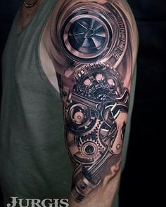 a man's arm with a clock and gears tattoo on it