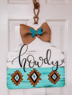 a door hanger with a bow on it