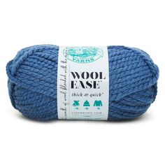 wool ease thick & quick yarn ball in blue, with white label on the front