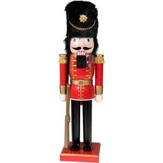 a nutcracker is standing on a red base