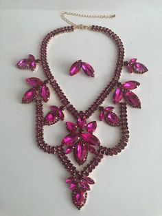 "Beautiful  pink statement  necklace  and earrings set shine and bright for any special occasional  Necklace length 16\"  with 7\" extender Statement height 4.5\" Earring: 1\"  Closure: lobster claw  Adjustable length  Return & exchanges We gladly accept cancellations Request a cancellation within 4 hour of purchase.  We don't accept return or exchanges but please contact us if You have any questions or any problem with your orders Thank you for shopping with us ♥️ Stay safe & healthy" Pink Crystal Jewelry For Evening, Pink Costume Jewelry For Party, Pink Costume Jewelry For Formal Occasions, Pink Costume Jewelry For Evening, Pink Formal Costume Jewelry, Formal Pink Costume Jewelry, Pink Jewelry For Valentine's Evening, Glamorous Pink Necklace For Party, Evening Pink Costume Jewelry