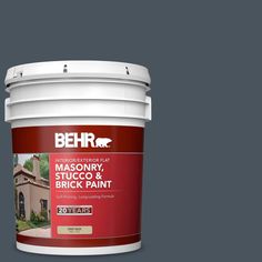 a red paint bucket with the words behrr on it and an image of a house