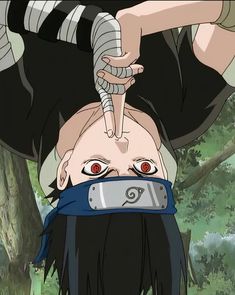 an anime character with his head tied up to the ground and hands on his hips