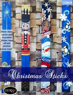 christmas stickers are hanging on the side of a brick wall with snowflakes and nutcrackers