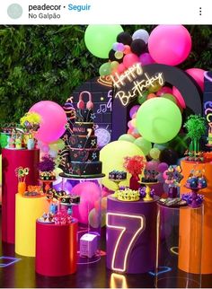 a birthday party with balloons, cake and decorations