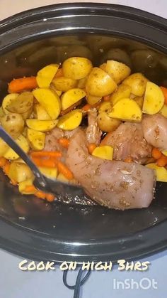 the food is being cooked in the crock pot on the stove with tongs