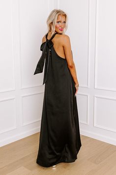 - Perfect for a date night in paradise, this gorgeous maxi is a must-have! - Satin finished material - A built-in lining ending above the knee - A v-cut neckline with a halter tied back with a keyhole detail - A flowy silhouette that ends in a maxi length hemline Black Floor-length Satin Maxi Dress, Black A-line Silk Maxi Dress, Black V-neck Maxi Dress With Back Opening, Black Sleeveless Pre-draped Maxi Dress, Black V-neck Maxi Dress With Flattering Silhouette, Satin Maxi, Leopard Dress, Satin Maxi Dress, Black Dresses Casual