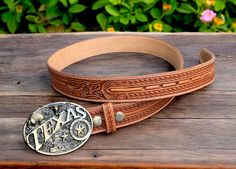 Texas, tooled and engraved embossed buckle Beautifully handmade western cowboy leather belt for men One-piece full grain genuine cowhide leather Western cowboy leather belt for men with a rodeo tooled buckle 1-1/2" Wide (38 millimeters wide) Handmade, tooled and embossed floral design The belt comes with a buckle, however the snap-on system allows you to customize the look of the belt with your own buckle of preference. Returns within 30 days of receiving Texas American belt buckle buckle Handcr Rustic Hand Tooled Belt Buckles For Western Events, Engraved Brown Belt Buckles For Western-themed Events, Engraved Western Belt For Ranch, Western Engraved Belts For Rodeo, Western Engraved Adjustable Belt, Western Style Engraved Belt For Ranch, Western Style Engraved Belts For Rodeo, Western Adjustable Engraved Belts, Western Brown Engraved Belt