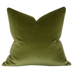 a green pillow on a white background