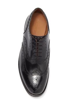 The Hendrix Wingtop Oxford will elevate your Instagram feed with timeless brogue details and stylish wingtip toe. Crafted from richly textured leather, these Oxford derby's classic wingtip design and perforated brogue accents add sophistication for everyday wear or your latest outfit posts. Delivering both vintage-inspired look and modern comfort with its leather lining and lightweight rubber heel, these Oxfords are sure to garner likes from followers seeking your expert style advice. Semi-formal Wingtip Oxfords With Leather Footbed, Semi-formal Oxford Leather Shoes With Goodyear Welt, Allen Edmonds Shoes, Semi-formal Oxford Leather Shoes With Brogue Detailing, Semi-formal Leather Oxford Shoes With Brogue Detailing, Semi-formal Brown Wingtip Derby Shoes, Allen Edmonds, Hendrix, Mens Oxfords