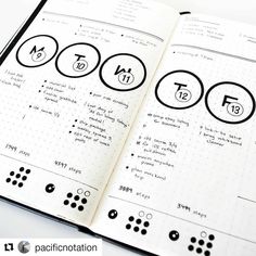 an open notebook with numbers and symbols on it