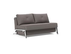 a gray couch sitting on top of a white floor next to a metal leg rest