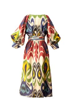 The Bahour ikat flared dress is a great special occasion dress. It features heart shaped elegant neckline and a reglan puff sleeves with a beautiful folded cuffs. The long sash with the tassels are decorated with hand-woven bands. You can wear this dress loose without the sash or with a sash to emphasize your waist. The dress has fabric covered button closure. Side pockets. 80% Silk/ 20% Cotton Length: 125cm Dry clean or hand wash with shampoo in cold water. Handmade in Uzbekistan BIBI HANUM Goddess Gown, Ikat Dress, Silk Ikat, Yellow Silk, Iconic Dresses, Special Occasion Dress, Flared Dress, Purple And Yellow, One Clothing