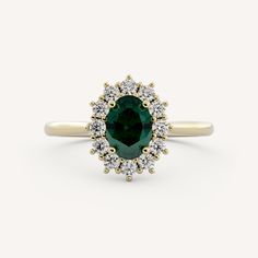 an oval cut green and white diamond ring