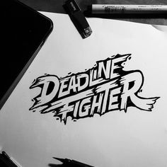 a notepad with the words deadline fighter on it next to a pen and marker