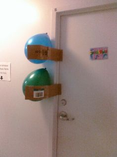 a door with two balloons attached to it