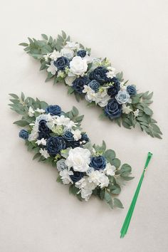 two blue and white flowers are next to each other with green stems in the middle