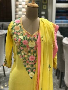 A stunningly marvellous outfit. This Suit features multi-colour Kashmir aari embroidery on the shirt neckline, on sleeves and 4 sided embroidery border on the dupatta with big floral booties on the corners.- - - - - - - - - - - - - - - - - - - - Product DetailsCondition: Brand NewF A B R I CShirt: Viscose GeorgetteDupatta: Viscose GeorgetteLower: Indian CrepeColour: YellowF I N I S HSemi-StitchedYou can get it stitched locally.47+ inches of Shirt Length and upto full sleeves length.StitchedWant Designer Unstitched Chanderi Suit With Floral Embroidery, Traditional Unstitched Suit With Floral Embroidery For Navratri, Yellow Churidar With Intricate Embroidery For Festivals, Embroidered Chinon Lawn Suit For Diwali, Embroidered Chinon Lawn Suit For Navratri, Multicolor Long Sleeve Unstitched Suit With Floral Embroidery, Fitted Yellow Lawn Suit With Resham Embroidery, Multicolor Floral Embroidered Unstitched Long Sleeve Suit, Festival Yellow Churidar With Intricate Embroidery