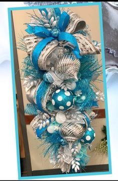 a blue and silver christmas tree with ornaments