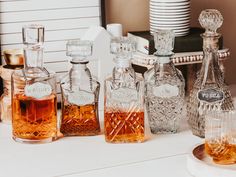 several different types of liquor bottles on a table