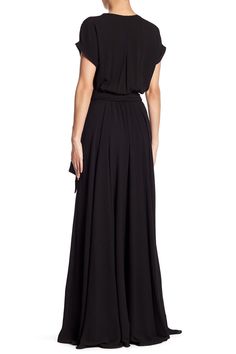 This maxi dress features a cross front V-shaped neckline with cuffed cap sleeves, an elasticized waist with a side seam attached belt and a sweeping maxi skirt for added drama. 56" length (size Small) Surplice V-neck Short sleeves 100% polyester with 100% rayon lining Hand wash, dry flat Made in the USA Model stats: 5'10" height, 32" bust, 25" waist, 36" hip. Model is wearing size Small. Wrap Maxi Dress, Maxi Wrap Dress, Nordstrom Dresses, V Shape, Drawstring Waist, Cap Sleeves, Nordstrom Rack, Maxi Skirt, Knee Length