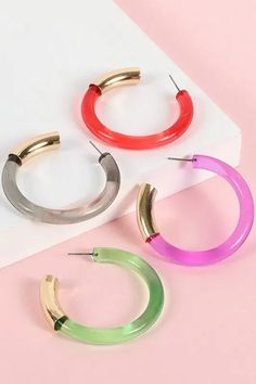 Get down tonight with these funky, brightly colored poly hoops, available in both purple and pink.Lucite hoop earrings with metal tube accent Material: Lucite, Zinc Lead Compliant, Nickle Free Trendy Multicolor Metal Hoop Earrings, Multicolor Modern Small Hoop Earrings, Modern Multicolor Small Hoop Earrings, Trendy Small Hoop Plastic Earrings, Trendy Plastic Hoop Earrings, Trendy Pink Beaded Hoop Earrings, Modern Small Hoop Earrings In Plastic, Modern Small Hoop Plastic Jewelry, Modern Plastic Hoop Earrings