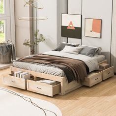 a bed with drawers underneath it in a bedroom