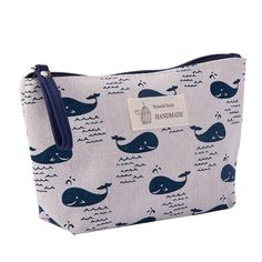 a blue and white whale print cosmetic bag