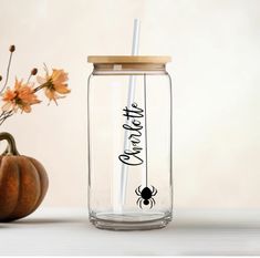 there is a glass jar with a straw in it