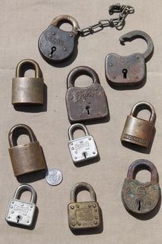 an assortment of padlocks are shown on the ground