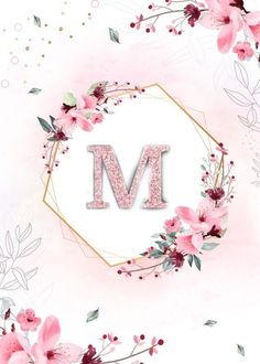 the letter m is surrounded by pink flowers