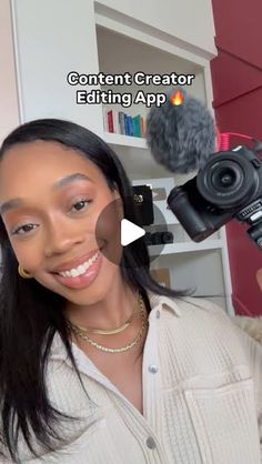 a woman holding up a camera to take a selfie with the caption'content creator editing app '