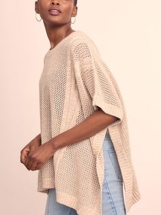 Refined neutrals. The sartorial bridge between two seasons, our open knit cotton poncho was made for the beach and beyond. Wear as a cover up, top layer to your lightweight denim, or foundation piece for your midi skirt. | J.McLaughlin Women's Katja Poncho Sand/Off White | Cotton