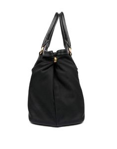 This Prada Women's Black Nylon Bauletto Handbag is luxurious and practical. There are three interior compartments with a zip divider, which is great for organizing and separating your personal belongings. The nylon material is durable and looks sleek with the black saffiano leather trim. The gold Prada Paris logo also goes beautifully with the black nylon. This designer bag is great for everyday use and can also be carried by the handles or adjustable nylon strap. Includes ity cards and Prada du Handbag Satchel, Paris Logo, Medium Handbags, Personal Belongings, Bag Model, Womenswear Fashion, Gold Logo, Designer Bag, Small Handbags