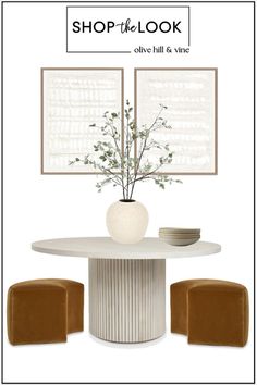 a white table with two brown chairs and a vase on top of it in front of the