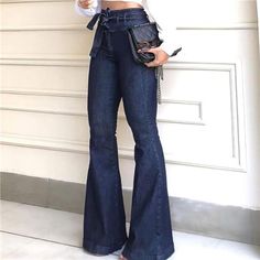 Elevate Your Denim Game With These Daring Dark Wash Bell Bottoms. These High Rise Denim Flare Jeans Offer A Stylish Twist On A Classic Silhouette, Featuring A Wide Leg Design That Exudes Retro Charm. The Tie Waist Bow Adds A Touch Of Elegance And Versatility, Allowing You To Create A Customized Fit That Accentuates Your Waistline Beautifully While The High Waisted Design Elongates Your Legs And Adds A Flattering Balance To Your Figure. The Carefully Crafted Dark Wash Denim To Effortlessly Comple Vestiti In Jeans, Wide Leg Pants Jeans, High Waist Wide Leg Jeans, Moda Jeans, Bell Bottom Pants, Dark Blue Jeans, Type Of Pants, Jeans Boyfriend, Jeans Flare