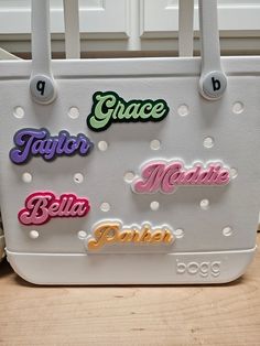 Personalize your beach bags and totes with these retro style font name plates! Fully customizable, you can pick your text, base/background color, and font color! I also offer two different sizes of charms so pick whichever fits the layout of your bag the best! Size simply impacts how large the font and charm is. it does not affect what type or size of bag you can put it on, so just pick whether you would like the charm to look bigger or smaller on your bag! Extremely easy to install! Utilizing a screw and socket system, just insert the charm socket into the desired hole on your bag and screw the custom printed screw into the socket on the charm. This insures a tight fit to your bag so the charm does not fall off or spin when in use! Each charm is 3D printed from a material called PLA. PLA Customizable Green Bags For Personalized Gifts, Customizable Multicolor Bags For Personalized Gifts, Fun Personalized Everyday Bags, Fun Personalized Bags, Fun Everyday Personalized Bags, Personalized Trendy White Bags, Retro White Bags With Letter Print, Retro White Bag With Letter Print, Trendy Personalized White Bags